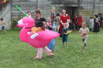 The children of the water battle hunting down a flamingo children with flamingo